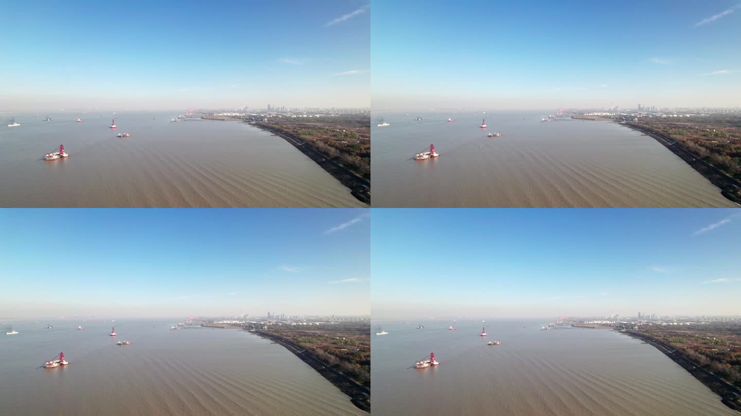 无人机拍摄的船只在靠近大海的河流上航行，高角度视角，上海港在长江入海口，4k实时镜头。
