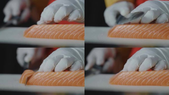 女厨师手用鱼片刀在餐厅切菜板上切新鲜的橙色鲑鱼肉，厨师为顾客准备健康菜单的鲑鱼生鱼片或寿司，日本料理