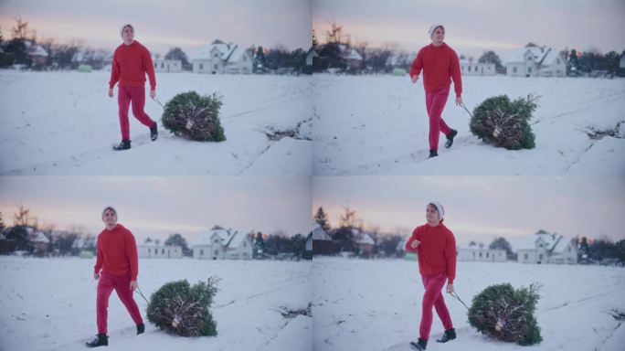 快乐的男人拉着雪橇和圣诞树在白雪覆盖的土地上