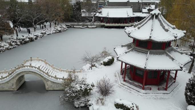 4k航拍古建筑雪景保定古莲花池雪景