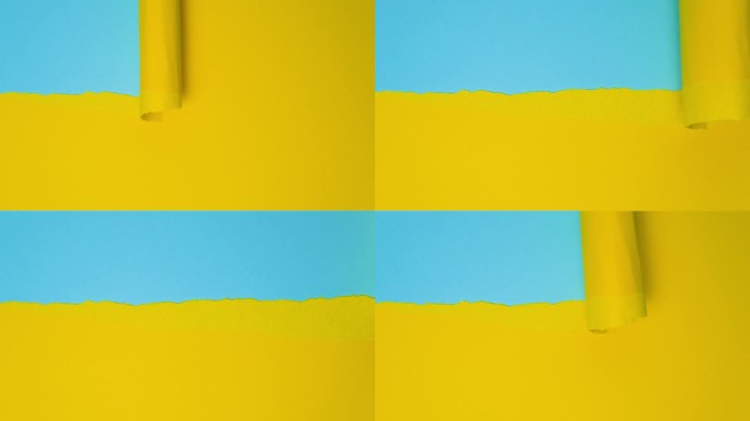 视频横幅与破纸。抽象撕纸视频在黄色和蓝色与复制空间。撕开的纸与蓝色背景文字的空间。