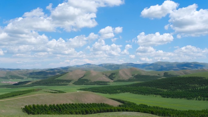 河北丰宁坝上草原群山电力风车蓝天白云延时