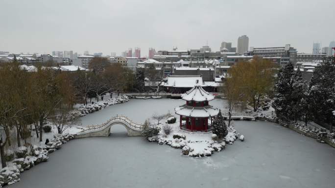 4k航拍古建筑雪景保定古莲花池雪景