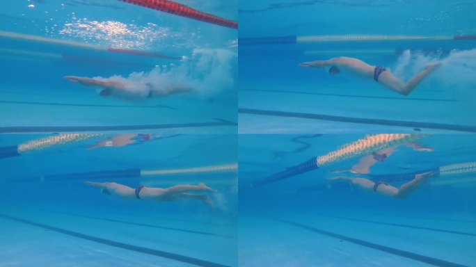专业泳池跳水。一名游泳运动员在训练中跳入水中。游泳比赛，水下射击。