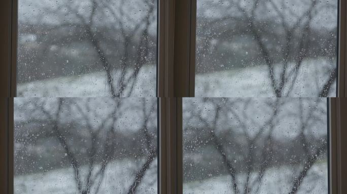 雨水打在玻璃窗上