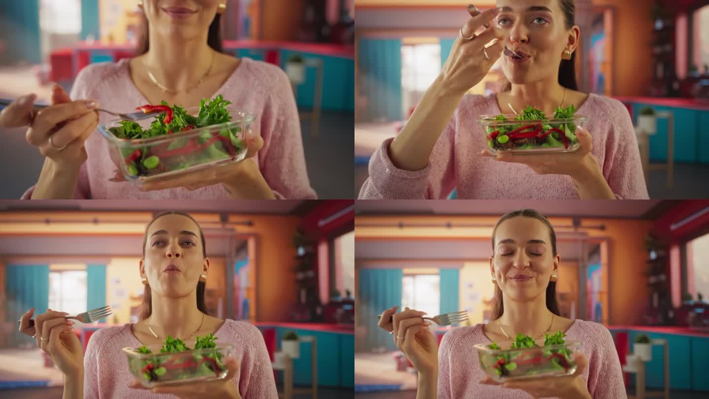一个美丽的女人在她五颜六色的公寓里享受素食餐的跟踪镜头。遵循健康饮食的女性素食者，注意她的卡路里和吃