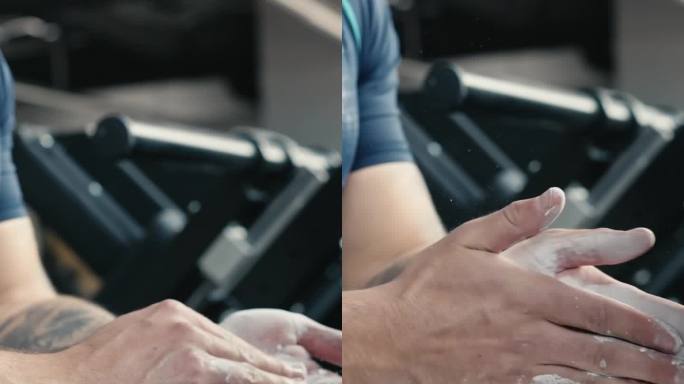 肌肉发达的男运动员在健身俱乐部锻炼前在手上涂抹运动粉笔的特写