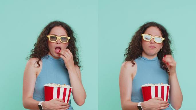戴着3D眼镜的女人吃着爆米花，看着有趣的电视连续剧，体育游戏电影，网络电影