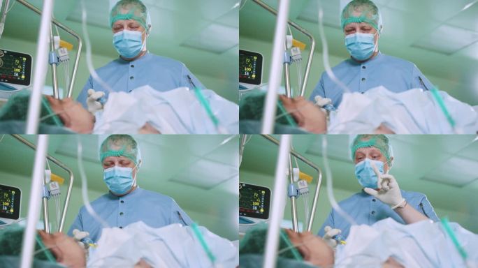 一名专业的、成熟的外科医生穿着长袍和口罩，在一场严重的手术前，在手术室里给局部麻醉的病人提供建议和安