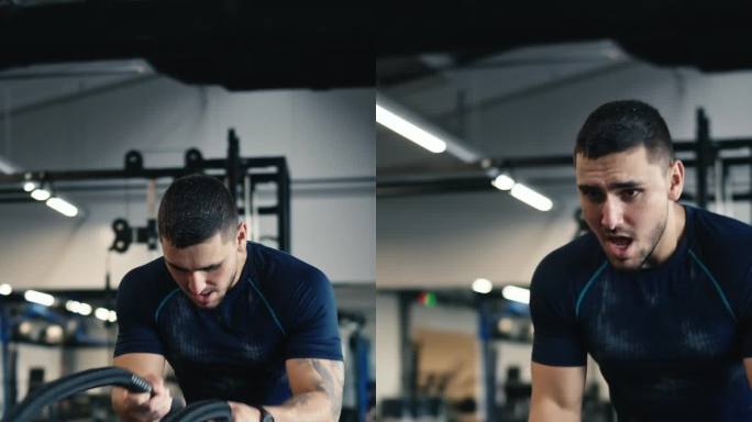 穿着运动服的强壮肌肉男子在健身房用绳索进行战斗训练
