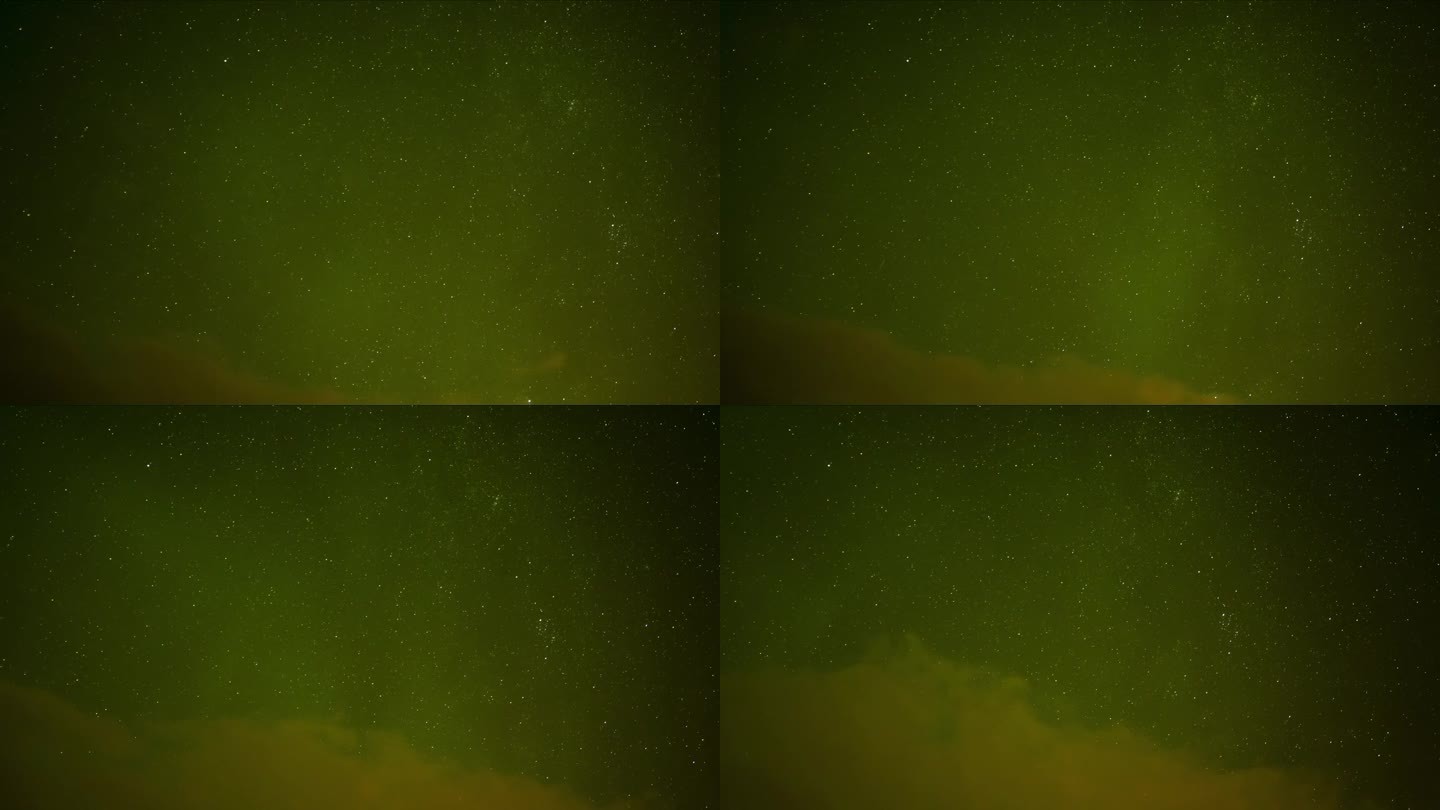 令人惊叹的绿色北极光。美丽的北极光闪耀在繁星点点的夜空中，流星体落下。云慢慢移向画面