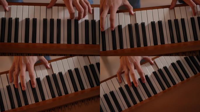 人的手弹钢琴的特写。上钢琴课，敲击键盘
