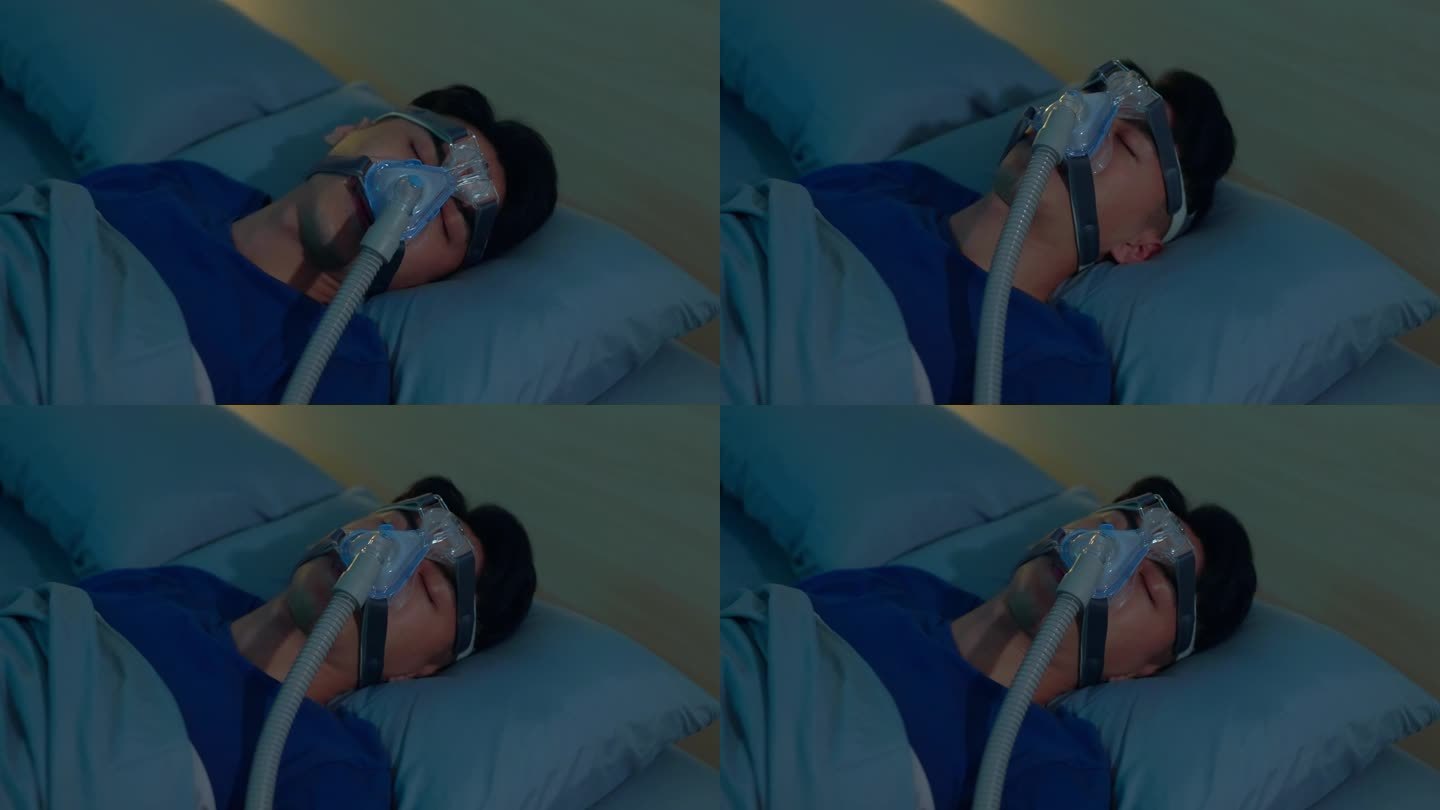 男人带着呼吸机睡觉