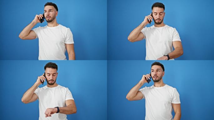 年轻的阿拉伯男子正在用智能手机通话，看着孤立的蓝色背景手表