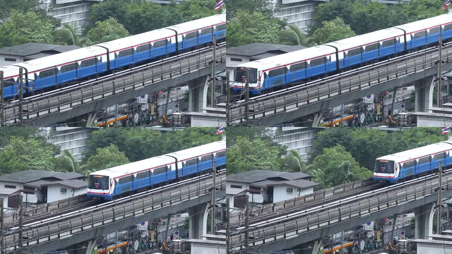 泰国曼谷——2021年6月8日:曼谷On Nut BTS站下起了暴雨。雨中火车在城市。恶劣的天气条件