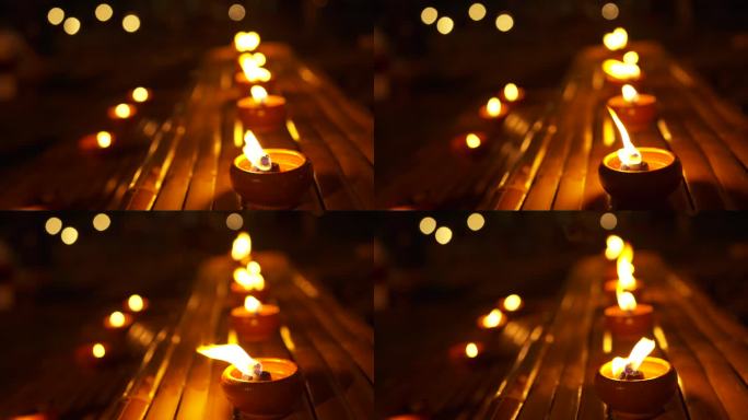 在木凳上燃烧的蜡烛，用来拜佛。