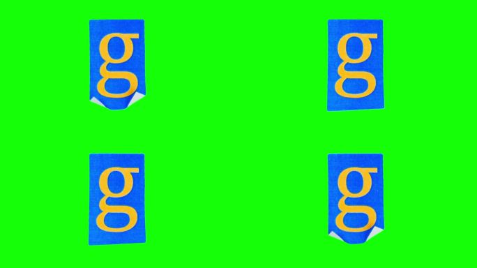 在一张皱巴巴的蓝色纸上，小写字母g以定格动作拍摄在绿色的屏幕上