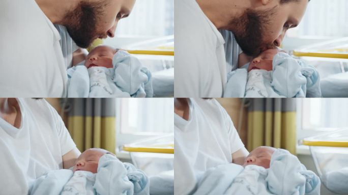 父亲在病房里抱着他可爱的新生儿。帅气的爸爸抱着刚出生的宝宝在产房。在病房里，快乐的父亲轻轻地抱着他可