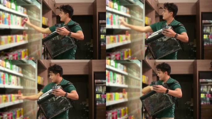 一个亚洲人在超市从网上订购中选择商品，网上送货的服务理念