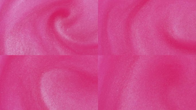 墨色底色闪闪发光的液体粉红色颗粒染料