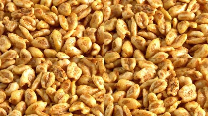 烤甜膨化小麦在宏观上像背景侧视图一样旋转。干早餐为你一天的工作补充能量