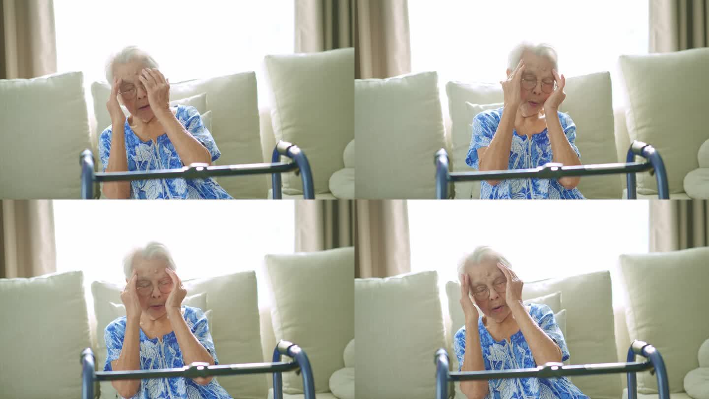 生病的老年女性高血压患者在家里沙发上头痛