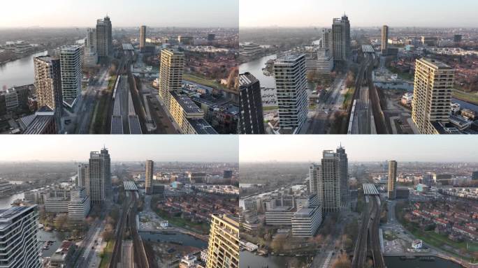 阿姆斯特丹阿姆斯特尔市城市无人机航拍交通和城市住宅建设塔。基础设施、火车站、商业大楼和天际线。水运河