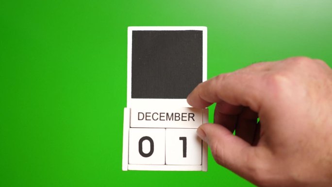 日历上的日期12月1日在一个绿色的背景。说明某一特定日期的事件。