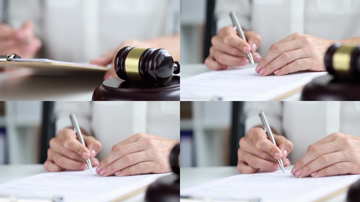 女士的手对着法官木槌4k电影的背景在文件上签字