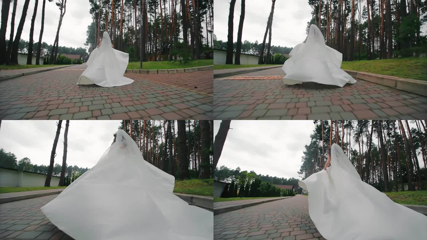 新娘穿着白色的礼服在公园里奔跑。在一个不幸的婚礼上，新娘从婚礼上逃跑了