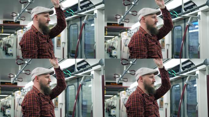 疲惫的睡眠不足的千禧一代乘地铁去市中心疲惫的戴着帽子的大胡子去上班努力工作挣钱的特写追求金钱的概念，