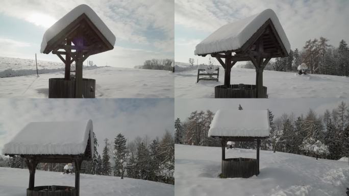 冬季花园中积雪覆盖的木结构