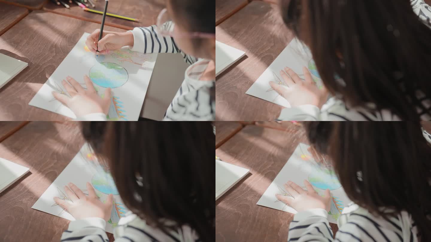 小可爱的小学亚洲女孩用彩色铅笔绘画艺术的主题是可持续发展，并照顾地球使用绿色能源资源，风力涡轮机。孩