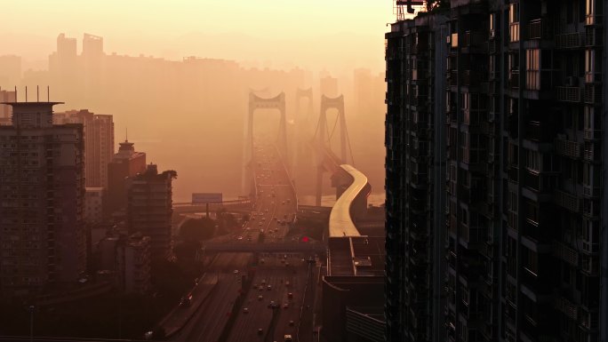 城市高楼大桥下的日出航拍