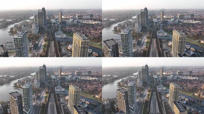 阿姆斯特丹阿姆斯特尔市城市无人机航拍交通和城市住宅建设塔。基础设施、火车站、商业大楼和天际线。水运河