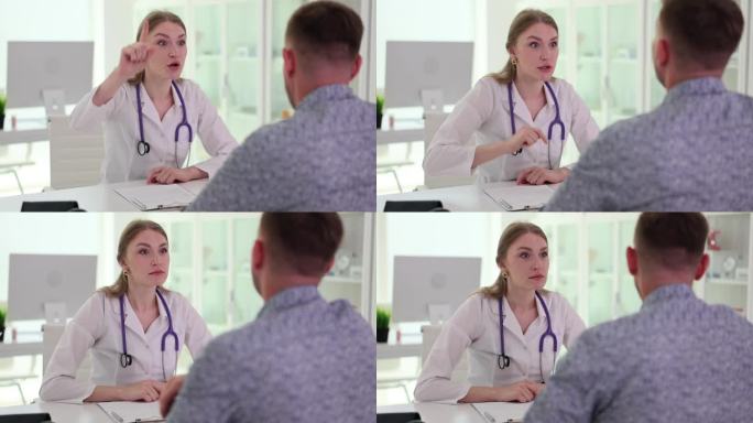 愤怒紧张的医生与诊所办公室的男病人争吵