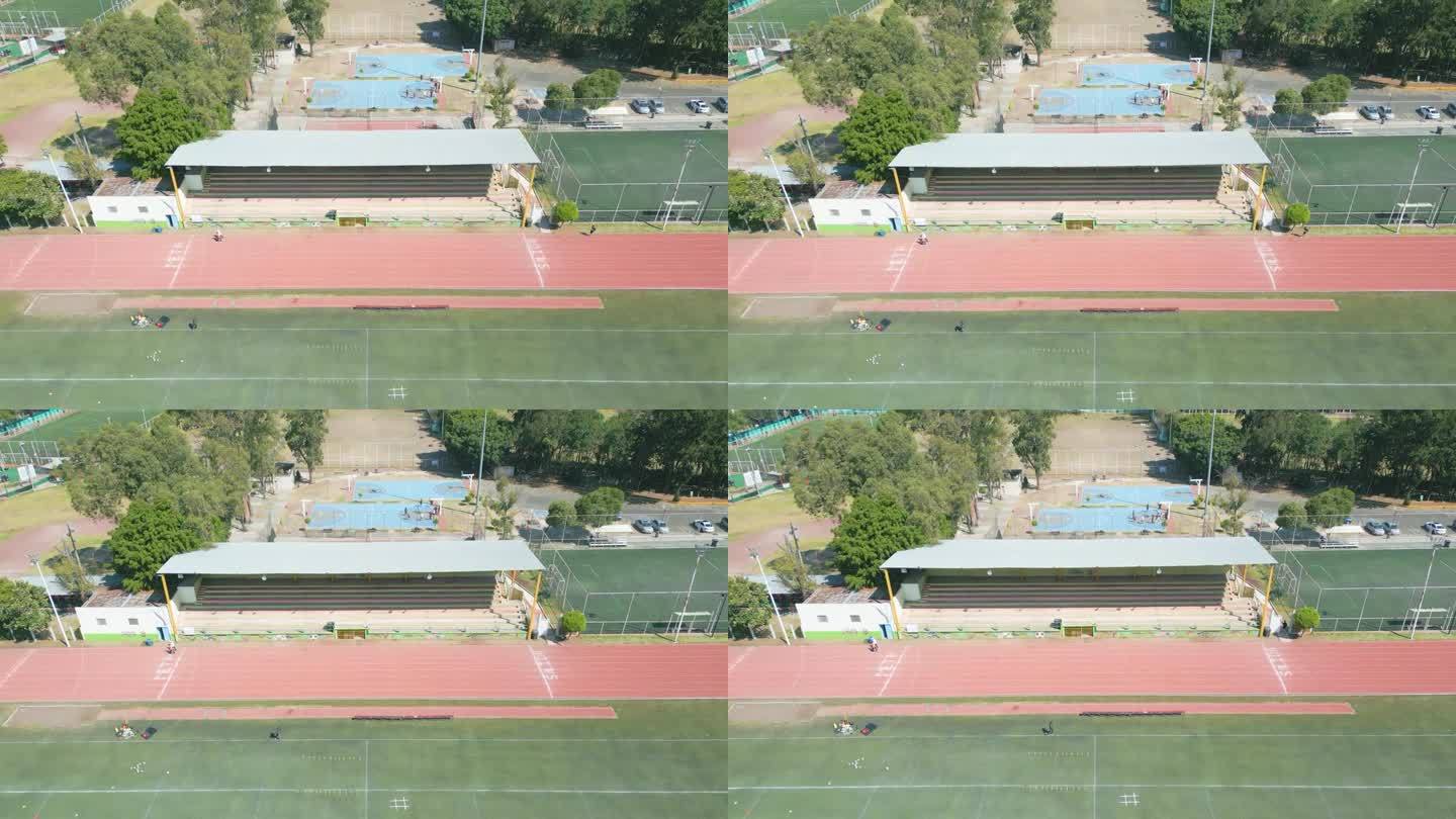 无人机拍摄的下午人们在奥运赛场上奔跑的画面