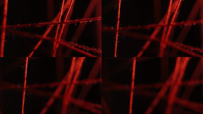 在黑色的背景上，红色的线在不同的方向和平面上伸展。破案