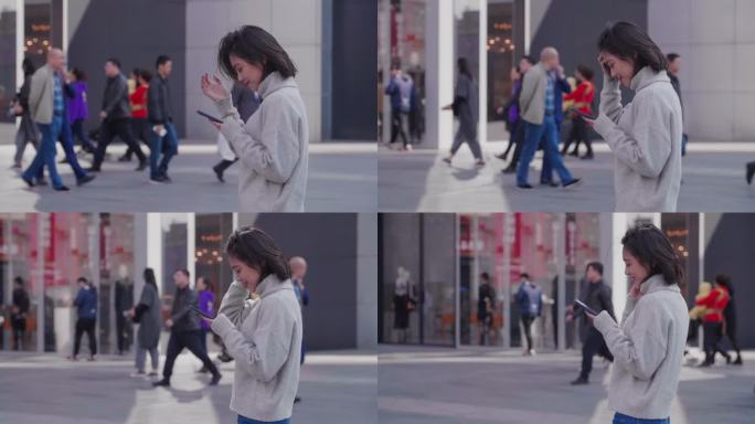 城市美女走路逛街看手机慢镜头