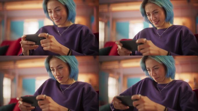 美丽时尚的蓝头发女人在她色彩缤纷的公寓里用智能手机玩电子游戏的慢动作肖像。女性青少年在在线合作游戏中
