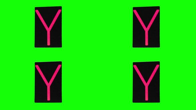 黑色皱纸上的粉色大写字母Y在绿色屏幕上以定格动作拍摄