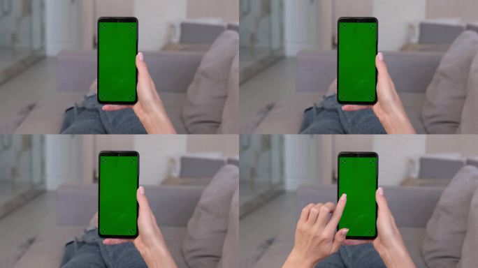 一名女子躺在家里的沙发上，在绿色的智能手机屏幕上向右滑动。