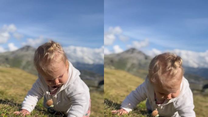 小女孩在阿尔卑斯山户外的草地上学爬