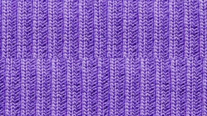 针织暖紫色毛衣或围巾宏观近距离质感，保暖成分羊毛面料近距离质感，舒适风格布料棉质。
