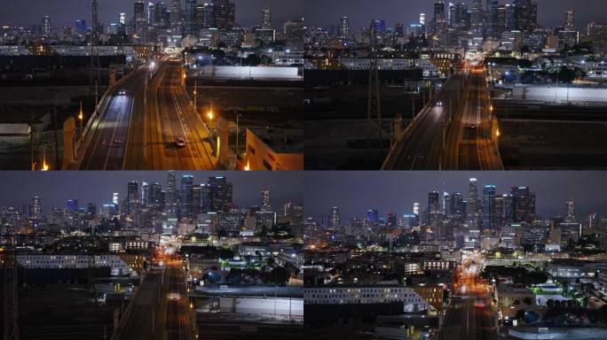 夜间，无人机在第一街大桥上向洛杉矶市中心飞行