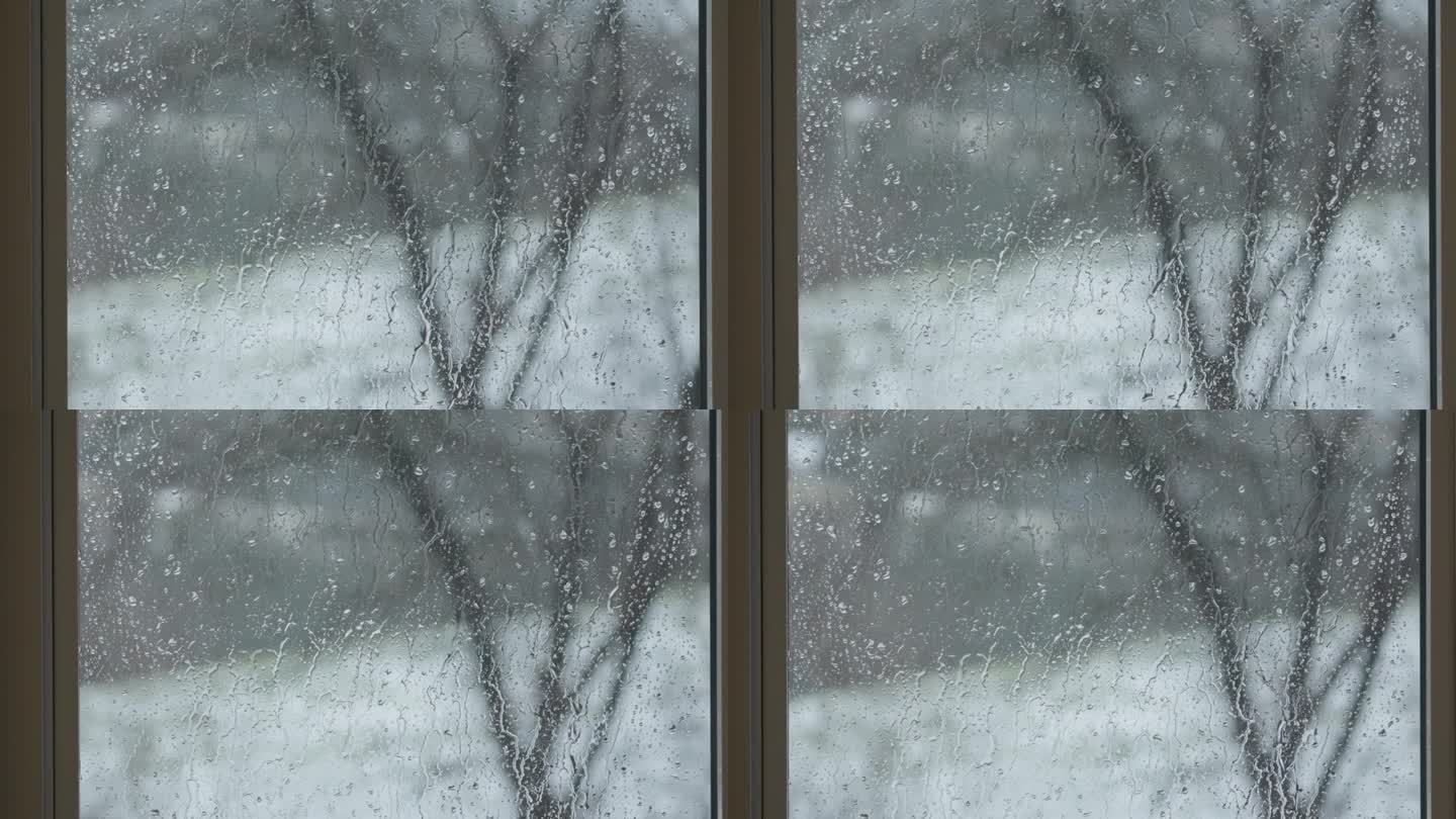 雨水打在玻璃窗上