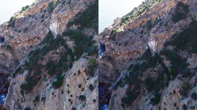 悬崖上的岩石楼梯向下延伸到大西洋。阿拉比达自然公园，葡萄牙。鸟瞰图垂直无人机拍摄