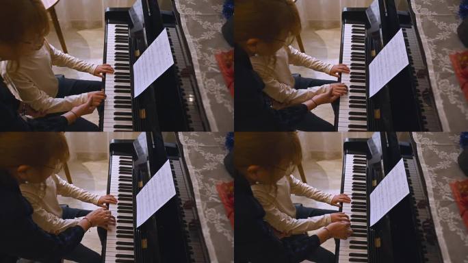 音乐教师，钢琴家，教钢琴，向学生解释手指在钢琴键上的正确位置