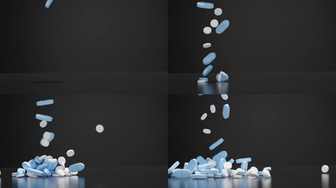 白色和蓝色的药片落在黑色的背景上
