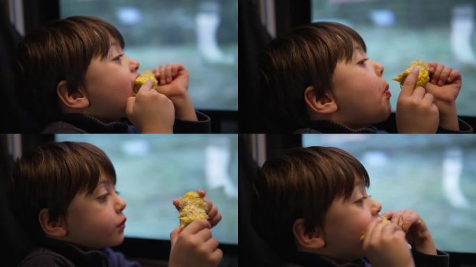 小男孩在火车上吃玉米当零食，乘客小孩一边吃东西一边盯着路过的风景